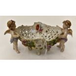 Ceramic pot holder held by two cherubs