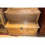 A small oak blanket chest and a 19th Century pine travelling trunk,