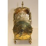 A Thomas Nudge brass cased mantle clock