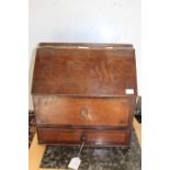 An 18th Century oak candle box with crossbanded ad inlaid panel to the front and crossbanded drawer