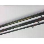 Angling interest: a pair of 11 ft Masterline John Wilson Avon / Quiver fishing rods in covers.