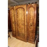 A Victorian walnut and decoupage decorated triple sectioned wardrobe,