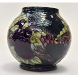 Modern Moorcroft Finch, grape and fruit decorated tube lined vase, with dark green ground,