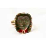 A bloodstone Intaglio with carved heart, with musical note detail, 9ct gold mount, size N,
