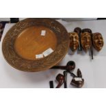 4 pipes and carved pipe holder with a carved wooden musical plate