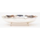 A George VI silver oval bon bon dish, wavy rim raised on four hoof feet, Lee & Wigfull, Sheffield,