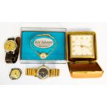 Collection of wrist watches and travel clock