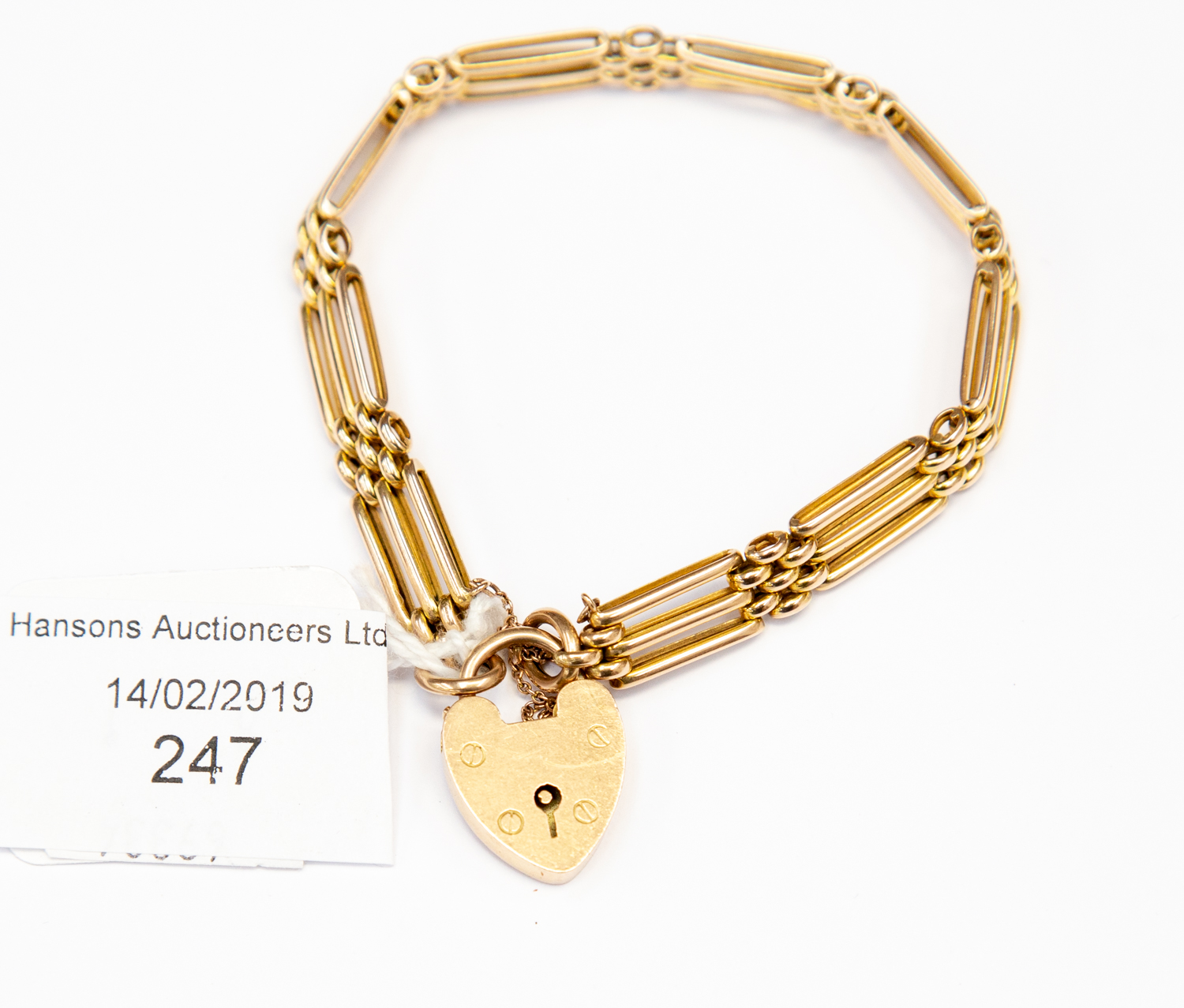 A 9 ct gold gate bracelet, three bar, padlock clasp, total gross weight approx 15.