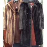 A faux fur dark brown full length coat,