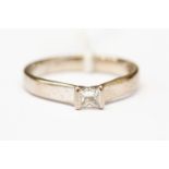 A diamond solitaire 18ct white gold ring, the Princess cut diamond approx 0.