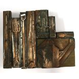 Eight copper mounted wood printing blocks, to include watering can, trowel,