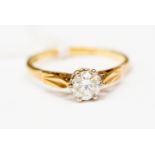An 18 ct gold ring claw set with a synthetic white spinel, stone size approx 0.