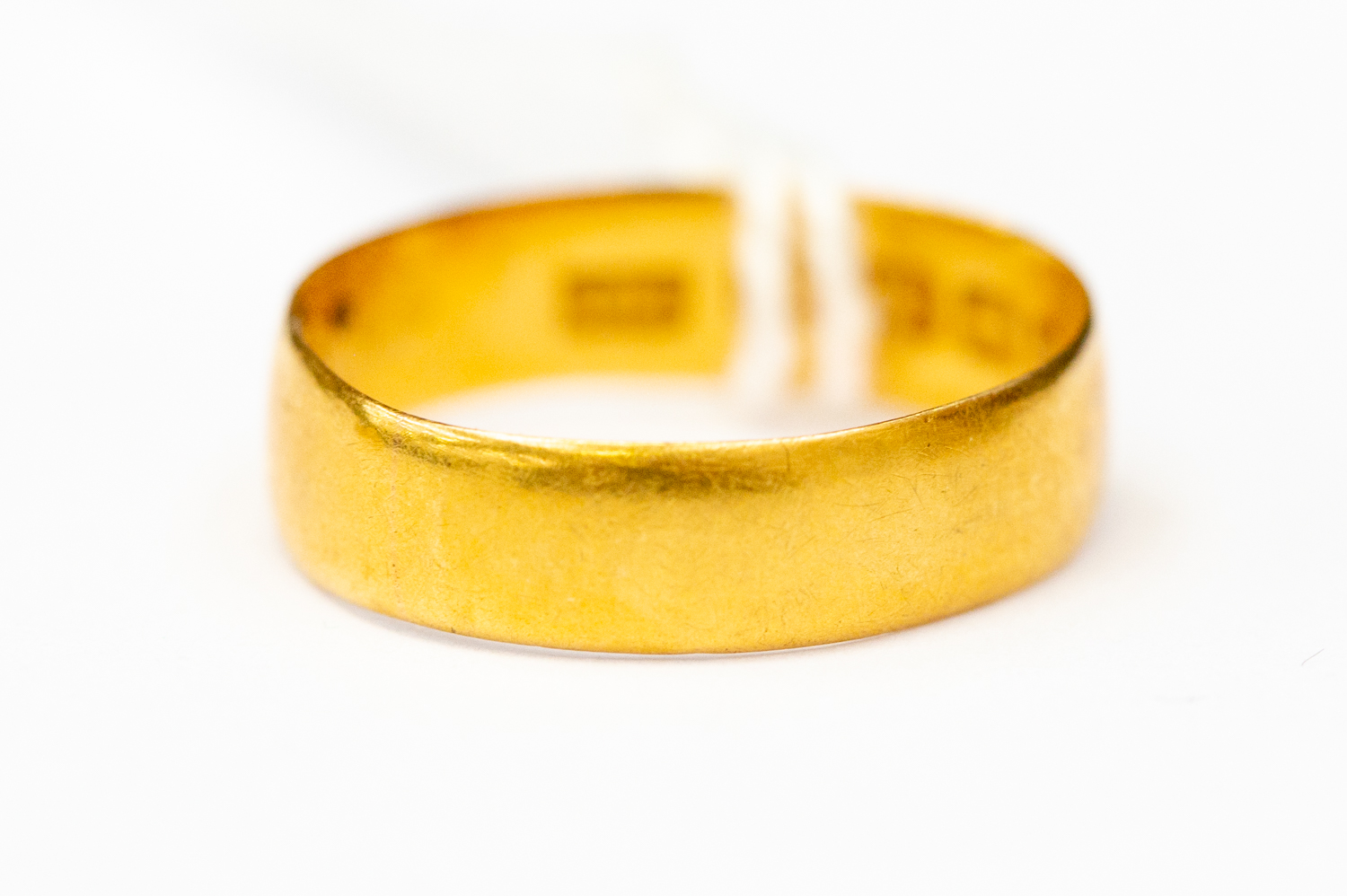 A 22 ct gold wedding band, size M, weighing approx 2.