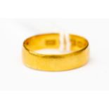 A 22 ct gold wedding band, size M, weighing approx 2.