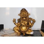 A late 18th century Sino-Tibetan gilt bronze of a seated Mahakala,