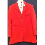 A Harry Hall red wool hunting jacket with a cream / red / black checked lining (gentleman's) size