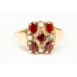 A garnet and opal 9ct gold dress ring