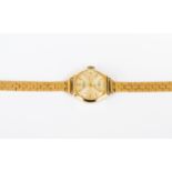 A 9ct gold ladies bracelet watch, round dial, with subsidiary dial, 9ct gold strap,