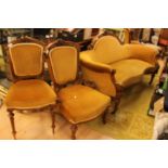 A mid Victorian walnut salon suite, comprising settee, gentleman's armchair, lady's chair,