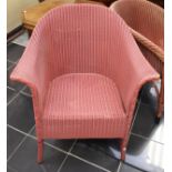 An early 20th Century pink Lloyd Loom bergere chair, 74cm high, 69cm wide,
