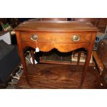 A George III bow fronted mahogany side table,