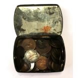 A tin of coins and tokens