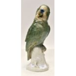 A German figure of green parrot imprinted Neullauser indistinct imprint to base