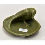 A Rookwood (American), a pottery dish modeled as a raven with green glaze,