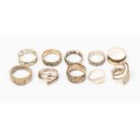 A collection of 10 silver rings various styles and sizes, including Celtic versions,