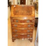 A George I style walnut ladies bureau, the fall front enclosing a fitted interior,