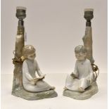 A pair of Lladro style Zephir lamps with continental fittings