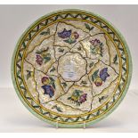 A Charlotte Rhead for Crown Ducal wall plaque, number 601d, stylised flowers and tube lining,