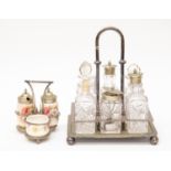 A Sheffield plate cruet stand on ball feet with six condiment bottles together with another cruet
