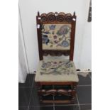 An early 20th Century Carolean style oak side chair, with an upholstered back, upholstered seat,