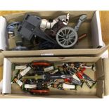 Two boxes containing metal hand painted soldiers and field gun and cannon