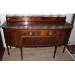 An Edwardian mahogany bow fronted sideboard, in the Georgian style, gallery back,