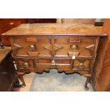 An 18th Century and later oak lowboy, fitted with two large drawers over three smaller drawers,