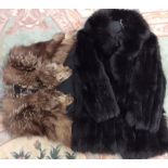 A black fox fur thigh length ladies jacket, shawl collar,