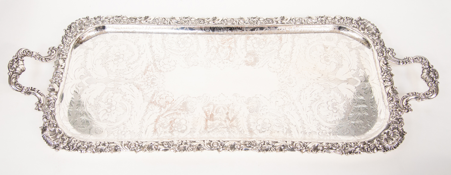 A Victorian style silver plate oblong two handled tray, cast border with fruit and foliage,