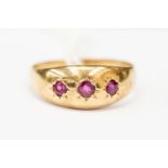 A ruby and 9ct gold ring, star set with three round cut rubies, size approx R,
