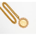 A 1903 Sovereign mounted in fancy 9ct gold mount, on an unmarked yellow metal chain, test as 9ct,