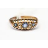 A sapphire and diamond set boat head ring, 18ct gold mount, size N, total gross weight approx 2,