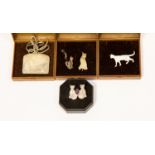 Cat interest; four silver brooches in the form of cats, one set with an amethyst,