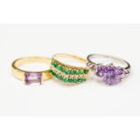 3 x 14 k marked dress rings, 1 white gold with purple stones and two yellow gold,