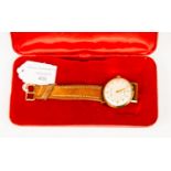 A gentleman's gold case Smiths Astral wrist watch, champagne dial,