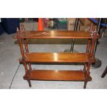 A late Victorian mahogany three tier What-not/wall shelf, each section raised on turned supports,