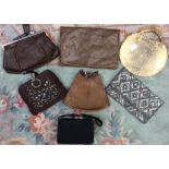 A collection of handbags, mainly French including; a snakeskin, a wedge shape,