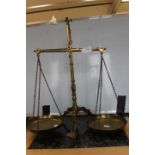 A pair of 19th Century brass balance scales, push lever action, stamped Vandome Titfords,