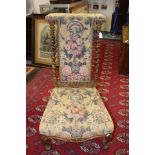 A late Victorian oak and beech prie dieu, having an upholstered back, barley twist uprightrs,
