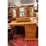 A collection of pine furniture comprising a pair of bedside chests,